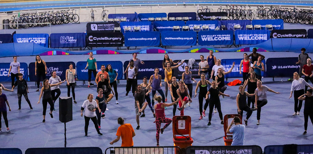 A Drum n Bounce class being delivered to a large crowd at an event. 