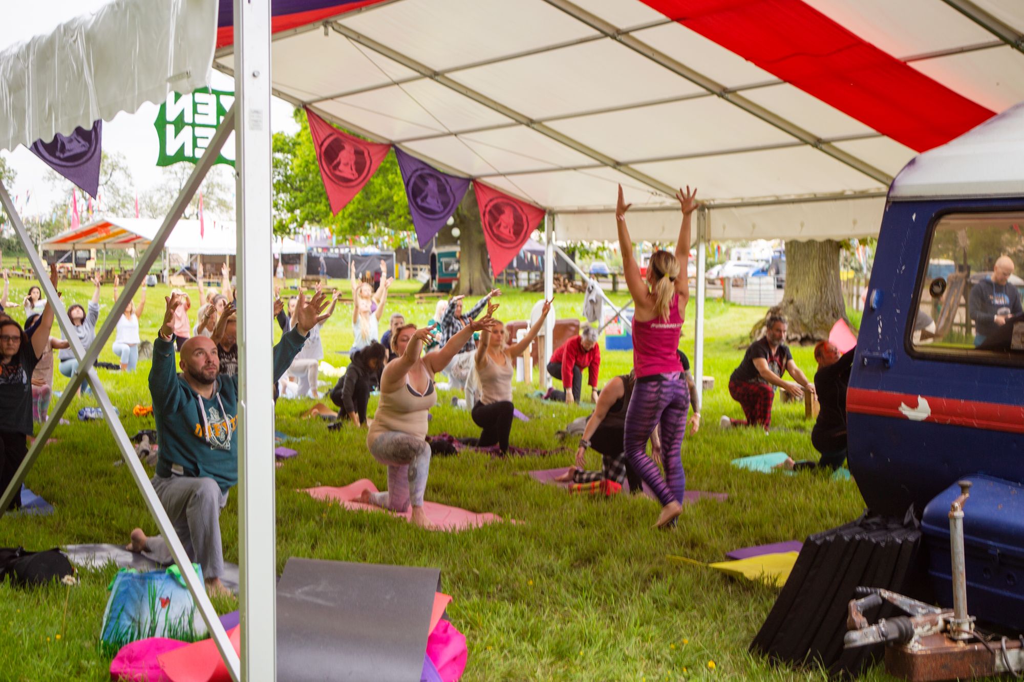 Emma teaching Drum n Bounce and yoga at a festival.